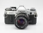 Canon AE-1 + 50mm 1:1.8 FD Analoge camera, Audio, Tv en Foto, Fotocamera's Analoog, Nieuw