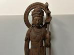 Large wooden sculptured Kannon statue with lotus flower on