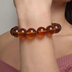 Natuurlijk bruin amber armband met sterke blauwe