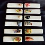 Exclusieve keramische bestekleggers versierd met vissen en