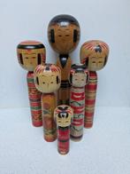 Een indrukwekkende set vintage Kokeshi in verschillende