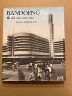 R.P.G.A. Voskuil - Bandoeng - Beeld van een Stad nieuwstaat, Verzenden, Zo goed als nieuw