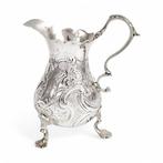 George II sterling silver milk jug embossed with dog and, Antiek en Kunst