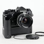 Nikon FE black + Nikkor 2/50mm + MD-12 | Analoge camera, Nieuw