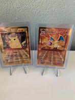 Pokémon - 2 Card - gold cards charizard & Pikachu metal, Hobby en Vrije tijd, Verzamelkaartspellen | Pokémon, Nieuw