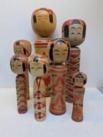 Een indrukwekkende set vintage Kokeshi in verschillende