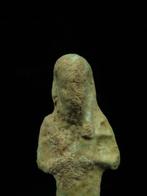 Oud-Egyptisch Faience Ushabti die een schoffel en een