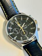 Seiko - Black dial -contrasting white markers and yellow