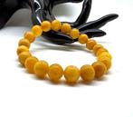 Armband met Baltische amber kralen in eigeel kleur. -