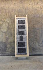 Drukblokken - een letterbak “DESIGN” met een volledig NIEUW