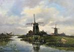 N.G van Os (1895-1976) - Landschap met molens
