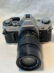 Canon AE-1 spiegelreflex camera + 135 mm 3.5 lens