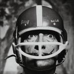 Philippe Halsman - Salvador Dalí wearing a football helmet,