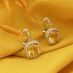18 Krt. Gouden oorstekers met citrien en diamant | 0,24 ct., Gebruikt, Overige kleuren, Ophalen of Verzenden, Met edelsteen